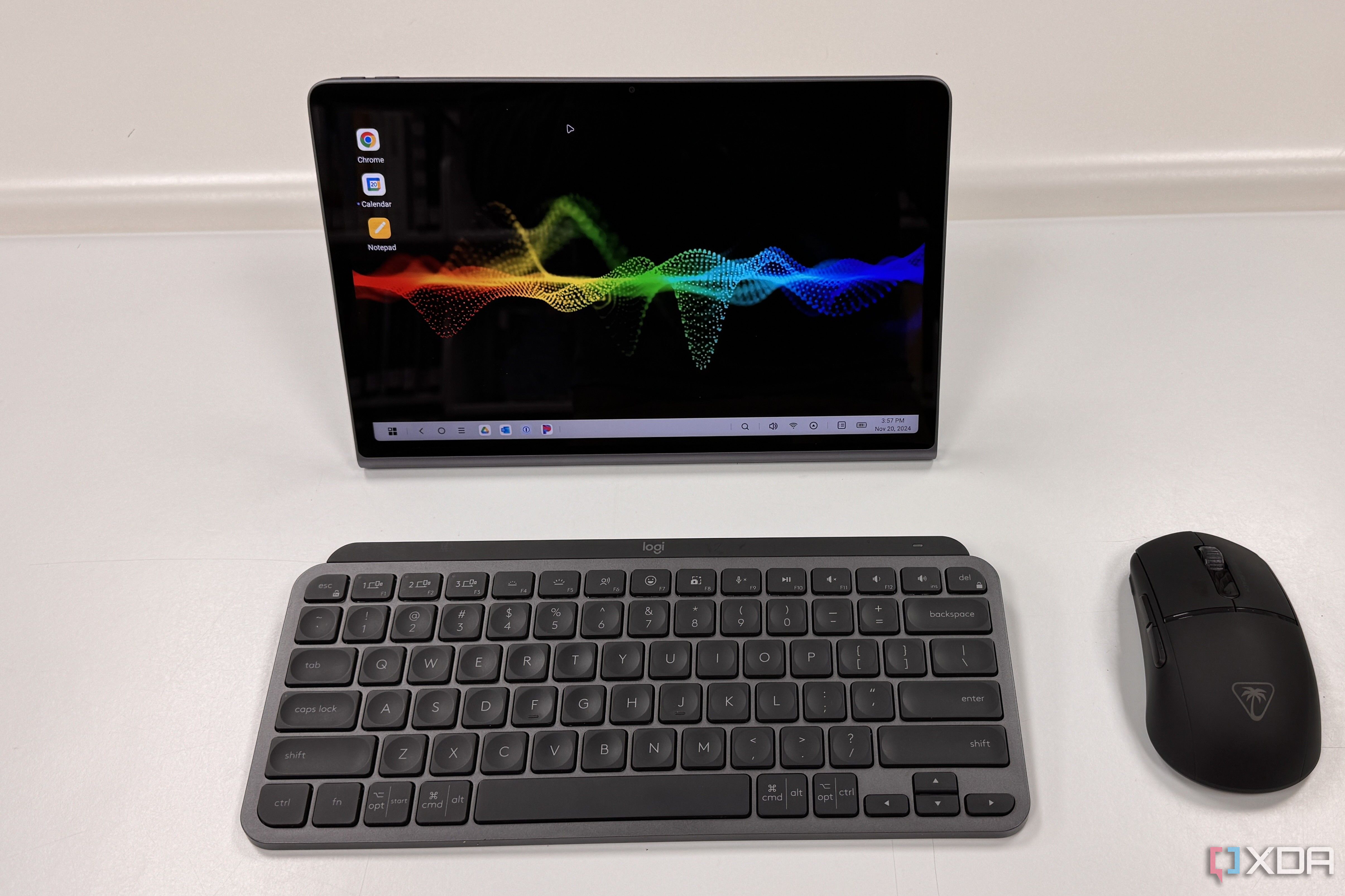 Lenovo Tab Plus straight on with keyboard and mouse on a white table