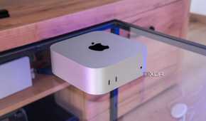 Angled view of the M4 Mac Mini on a glass table