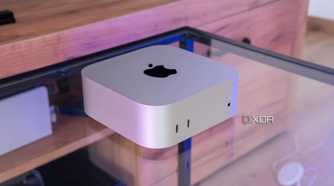 Angled view of the M4 Mac Mini on a glass table