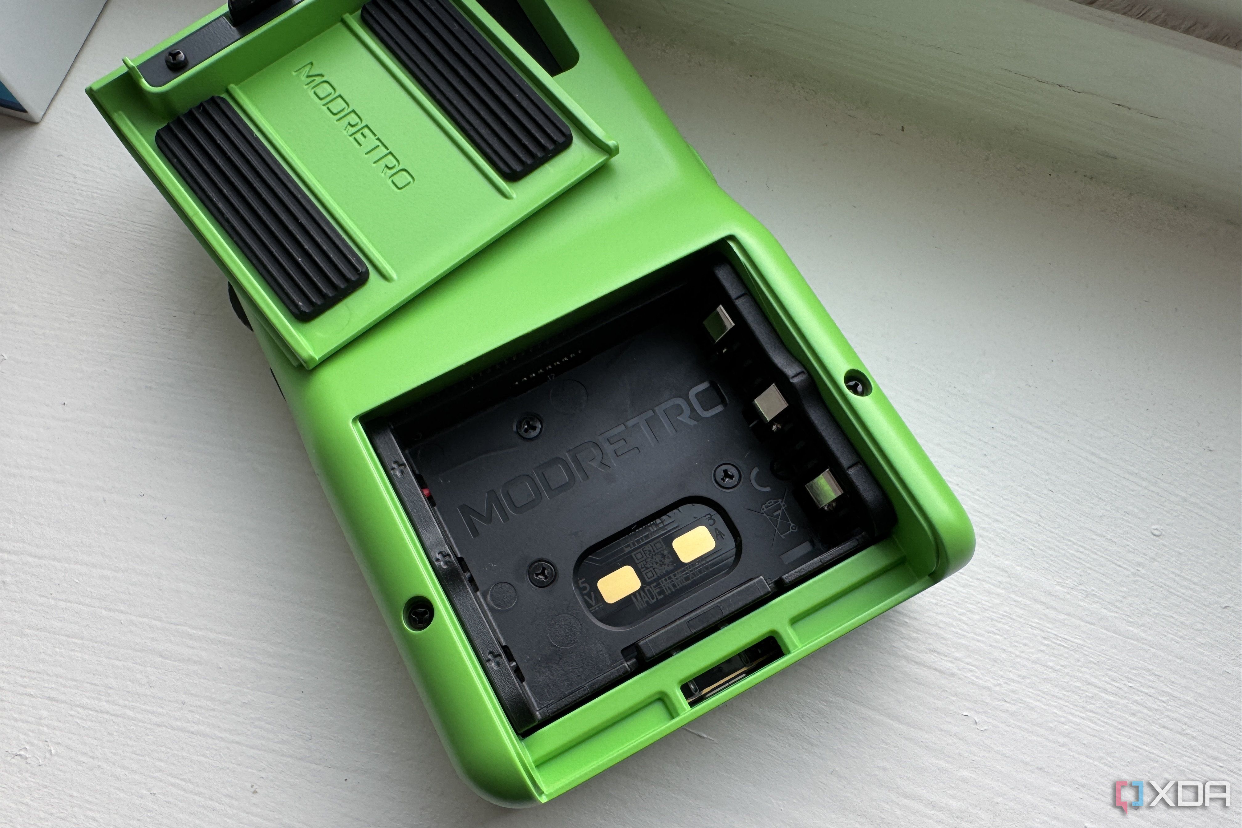 modretro chromatic in leaf color showing the battery connectors for the upcoming rechargeable battery pack