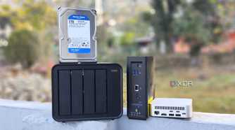 A TerraMaster F4-424 Max, F8 SSD Plus, and an Aiffro K100 placed side-by-side