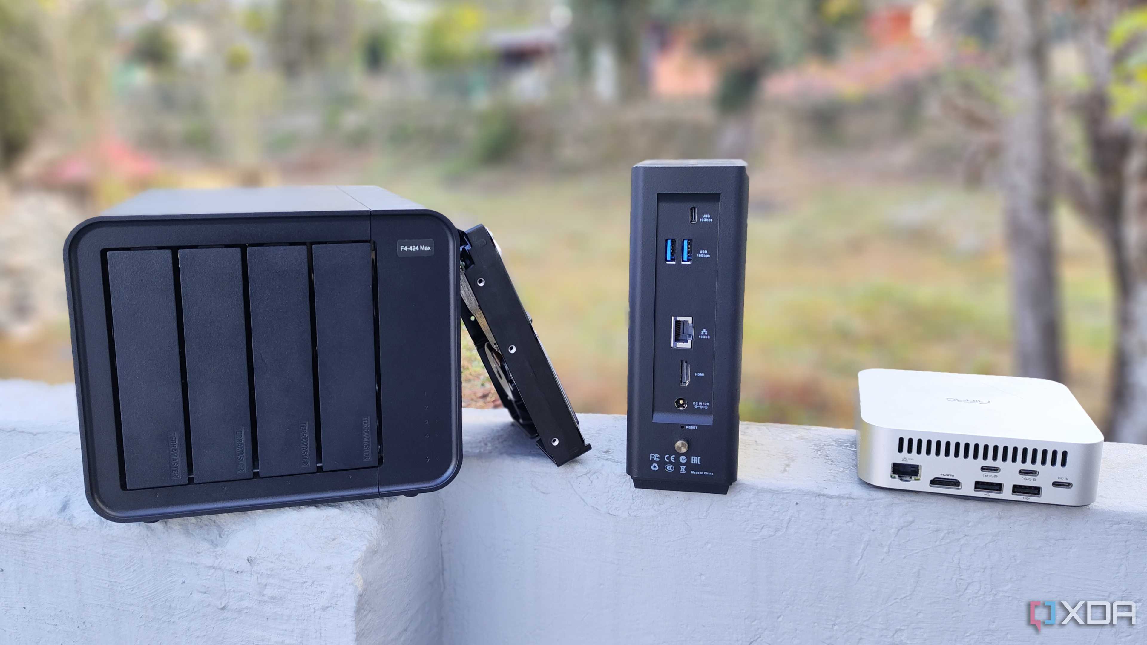 A TerraMaster F4-424 Max, F8 SSD Plus, and an Aiffro K100 placed side-by-side