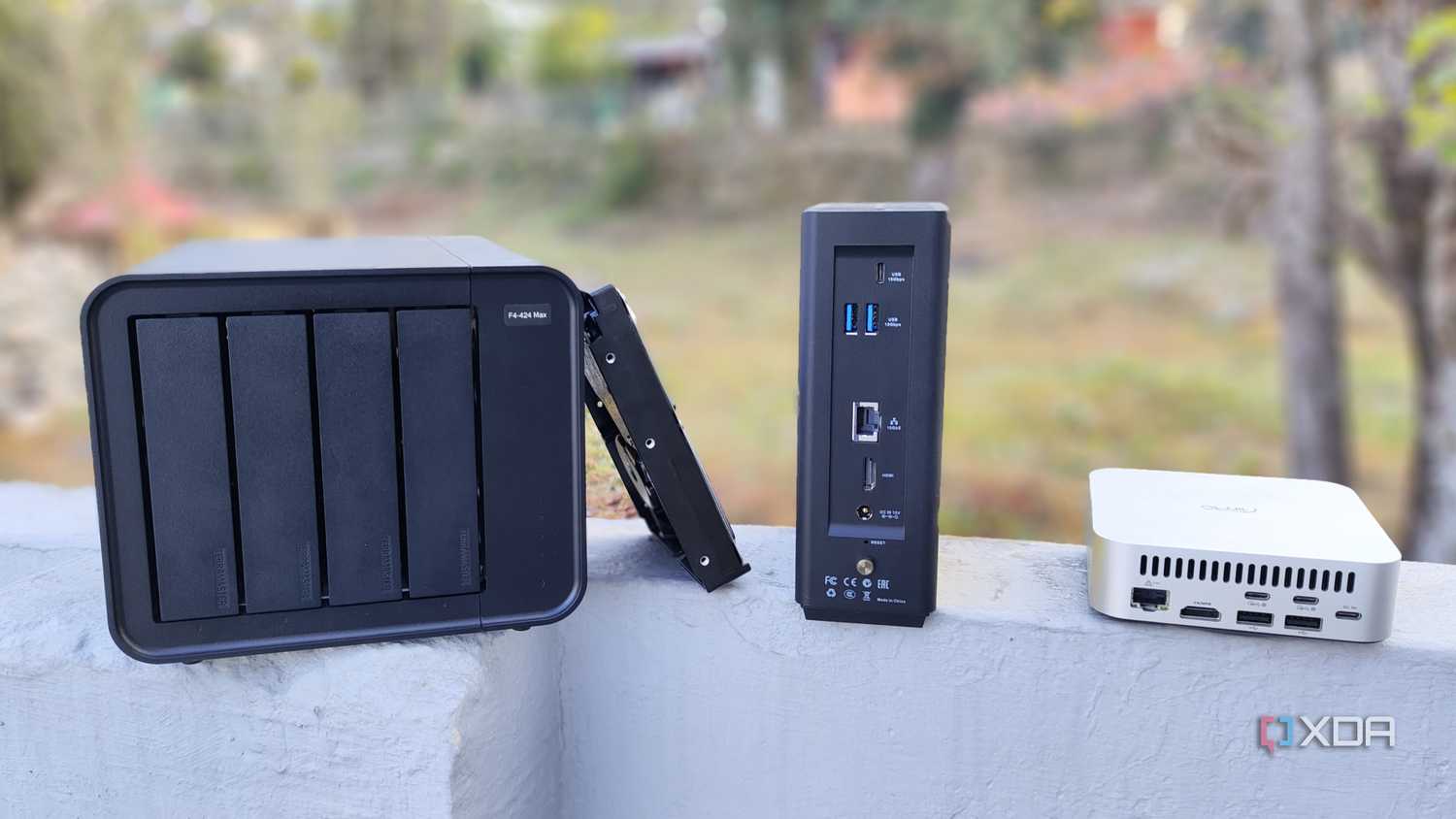 A TerraMaster F4-424 Max, F8 SSD Plus, and an Aiffro K100 placed side-by-side