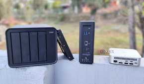 A TerraMaster F4-424 Max, F8 SSD Plus, and an Aiffro K100 placed side-by-side