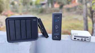 A TerraMaster F4-424 Max, F8 SSD Plus, and an Aiffro K100 placed side-by-side