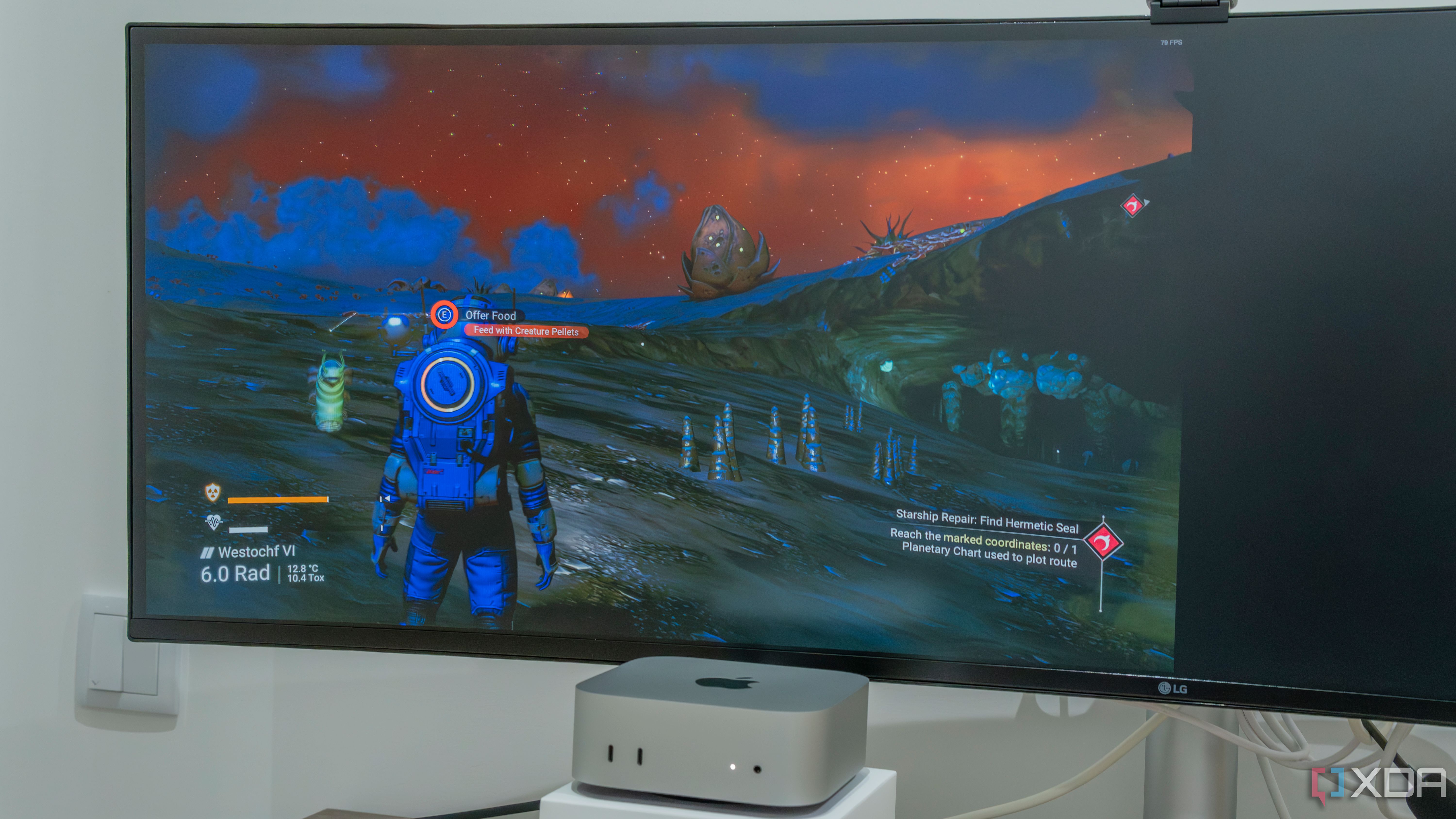 A Mac Mini with a monitor displaying No Man's Sky