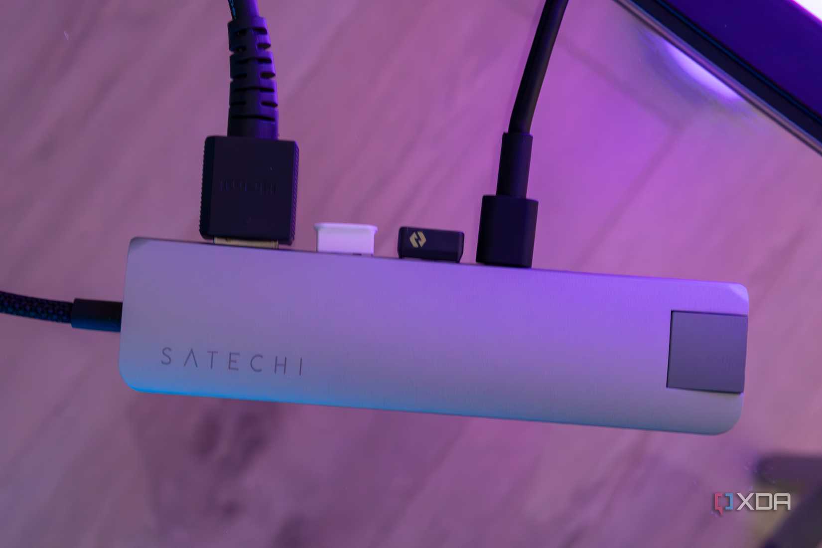 Top-down view of the Satechi 7-in-1 Slim USB-C Multi-Port Adapter with multiple devices plugged in