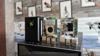 A Raspberry Pi 5, a Radxa X4, and a Libre Computer Alta SBC resting on top of a PC