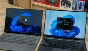 Two Windows 11 laptops side by side using Quick Share from Google