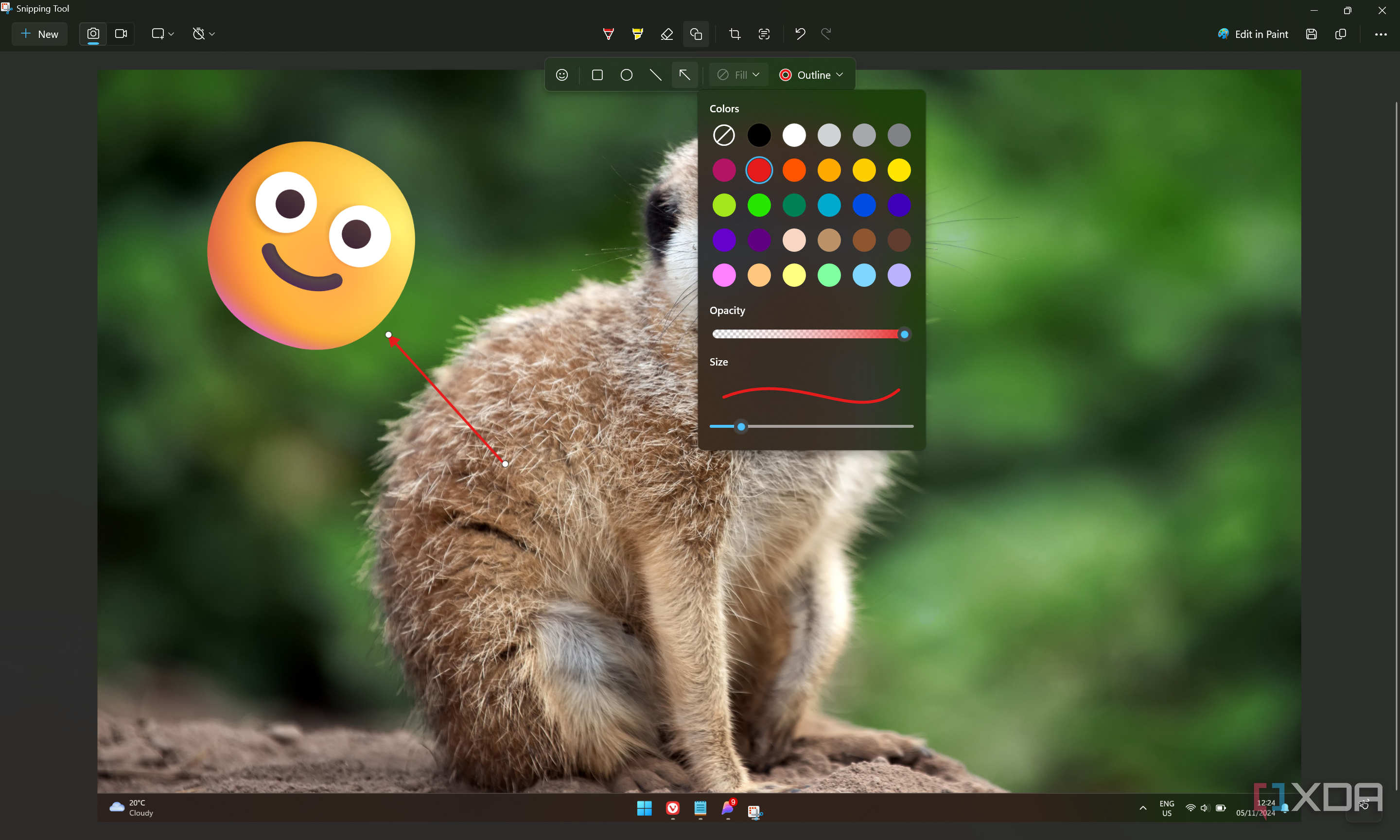 Screenshot of Snipping Tool showing an emoji and an arrow added with the app itself, as well as a menu showing color and transparency options for a shape