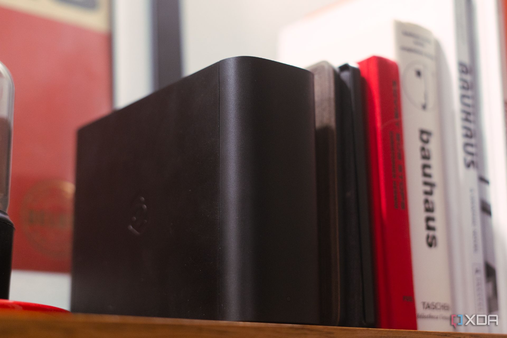 Picture of Synology BeeStation on a bookshelf