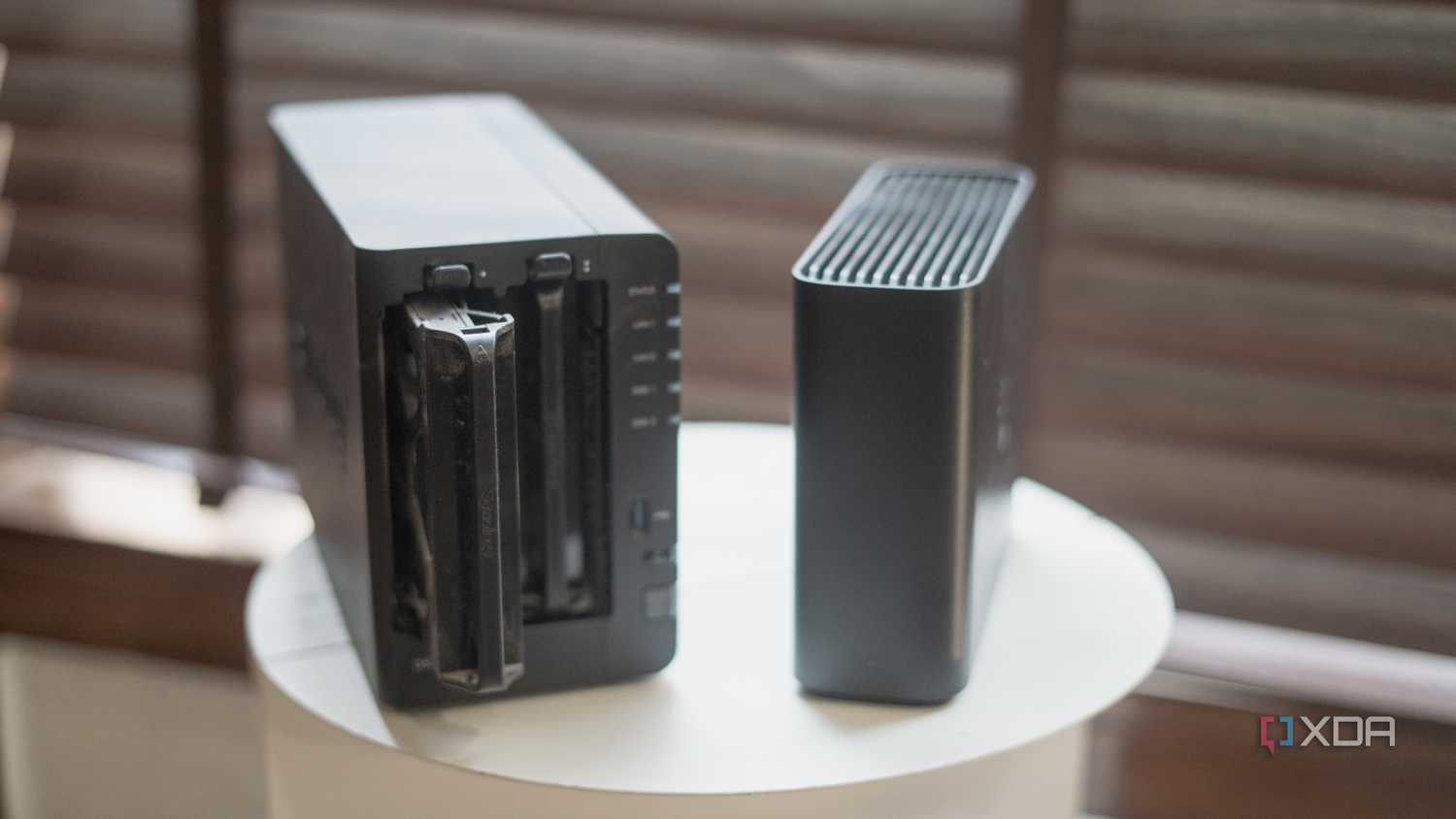 Synology Beestation vs NAS drive showing drive tray placed on a table