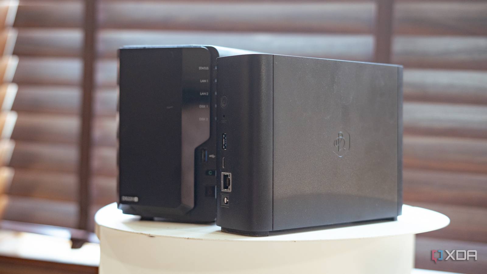 Synology Beestation vs NAS drive showing side profile placed on a table