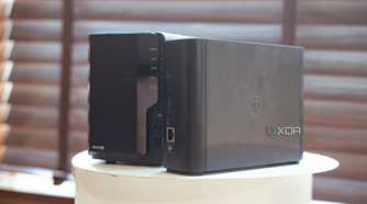 Synology Beestation vs NAS drive showing side profile placed on a table