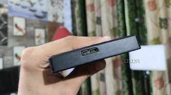 A person holding an external HDD
