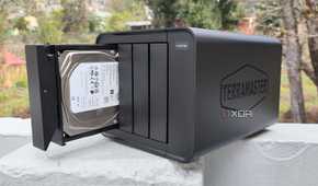 A person holding the TerraMaster F4-424 Max NAS