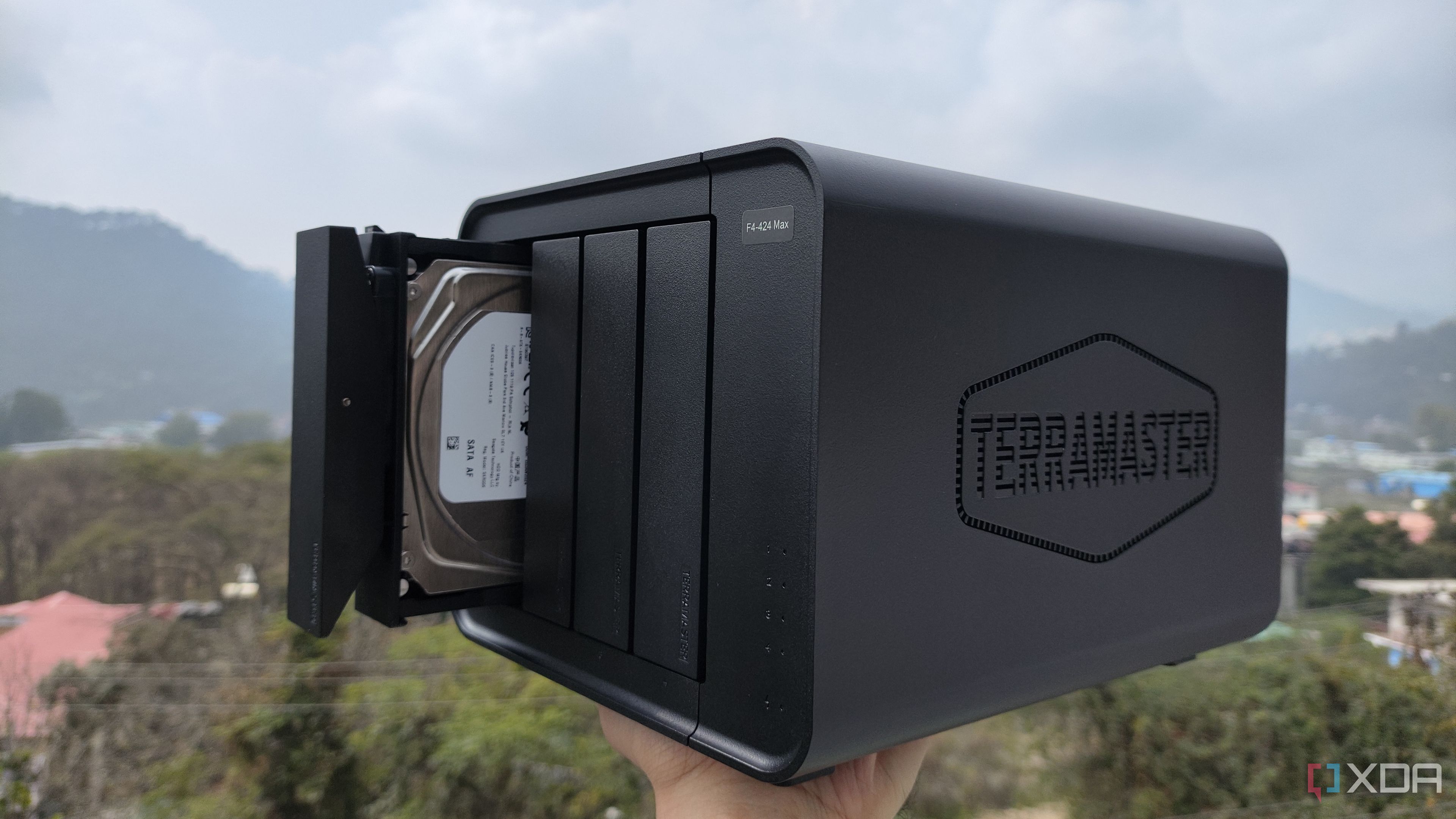 A person holding the TerraMaster F4-424 Max NAS