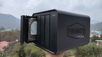 A person holding the TerraMaster F4-424 Max NAS
