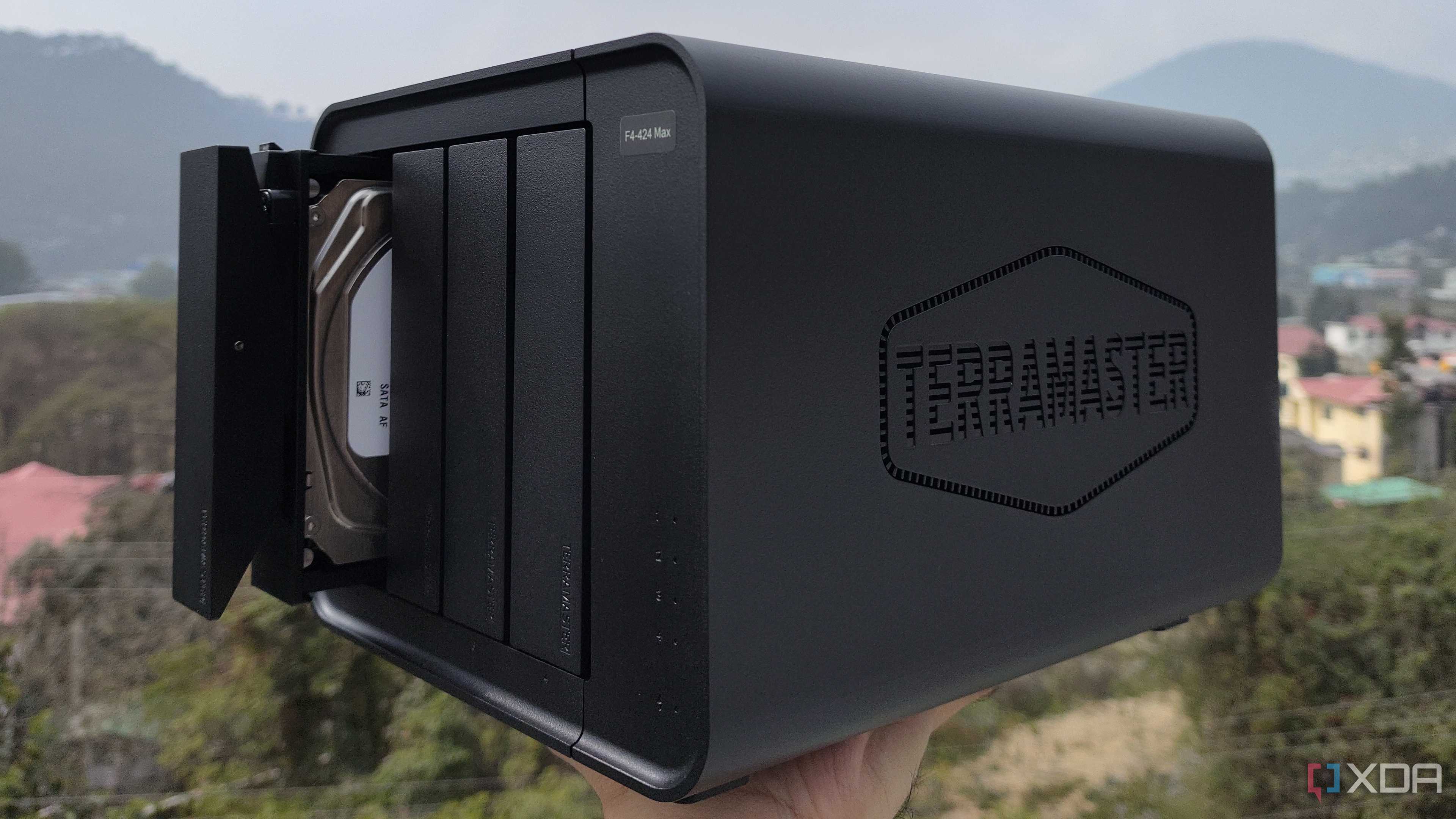 A person holding the TerraMaster F4-424 Max NAS