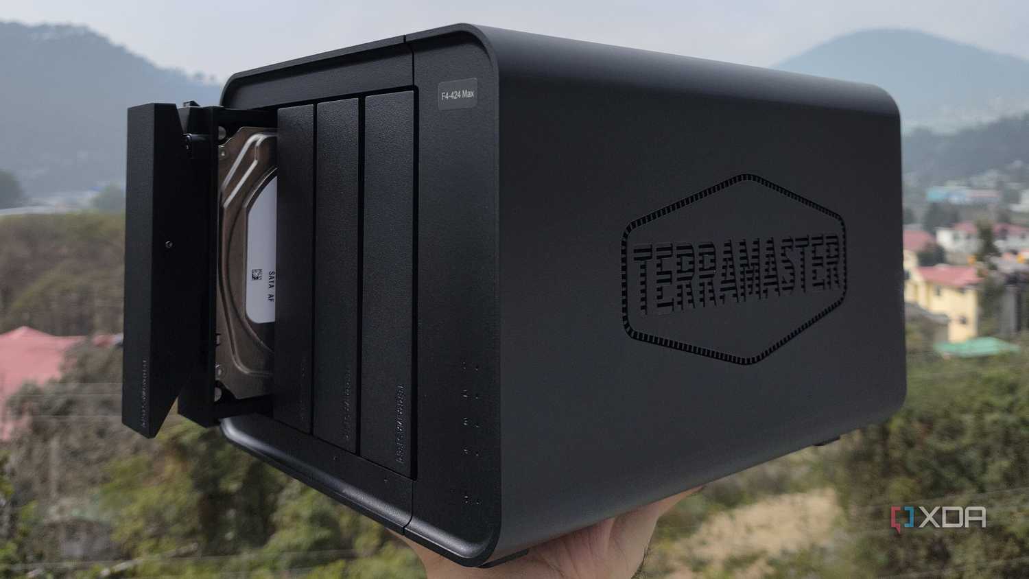 A person holding the TerraMaster F4-424 Max NAS