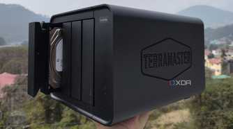 A person holding the TerraMaster F4-424 Max NAS