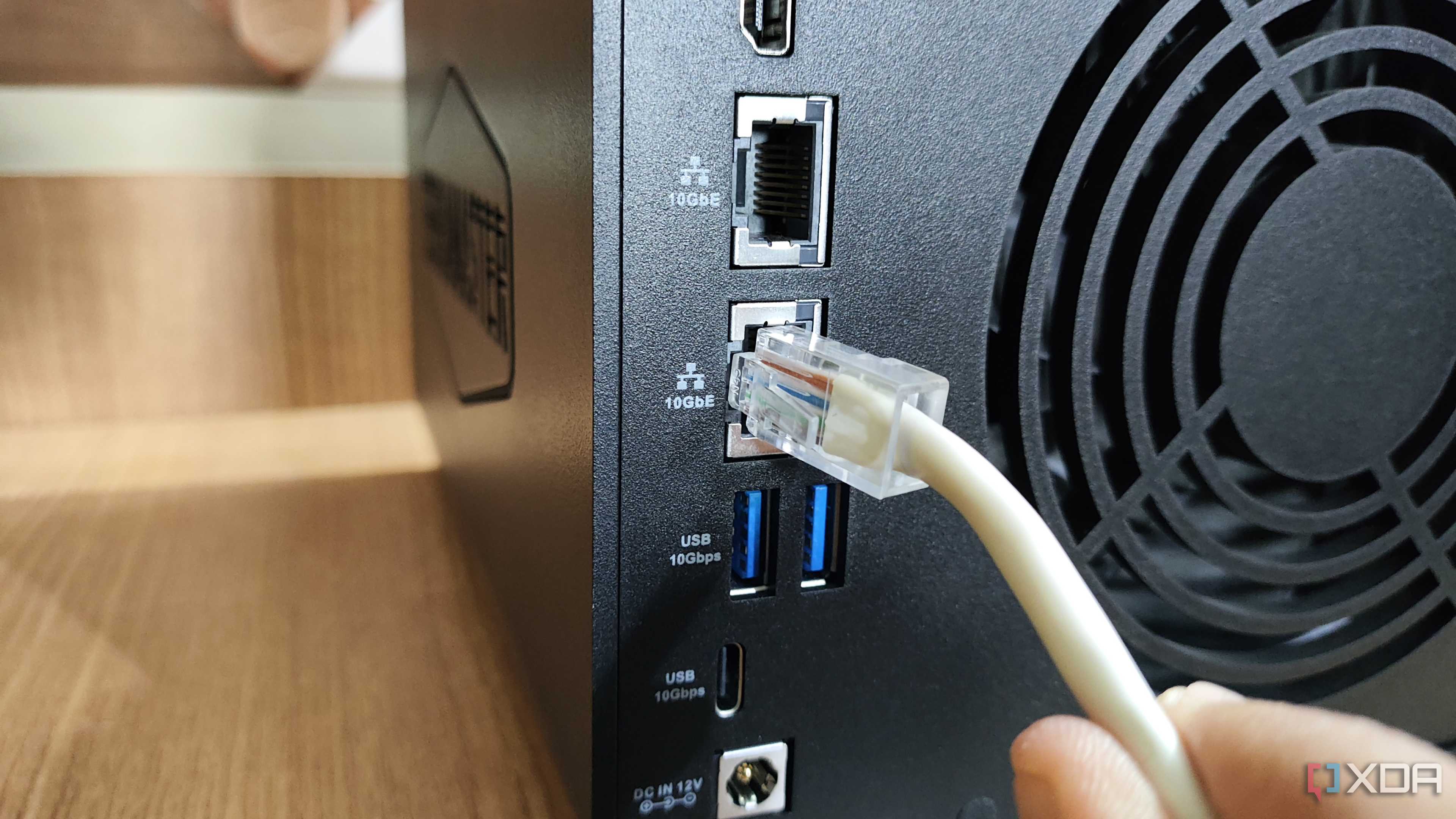 Plugging an Ethernet cable into the 10GbE LAN port on the TerraMaster F4-424 Max NAS