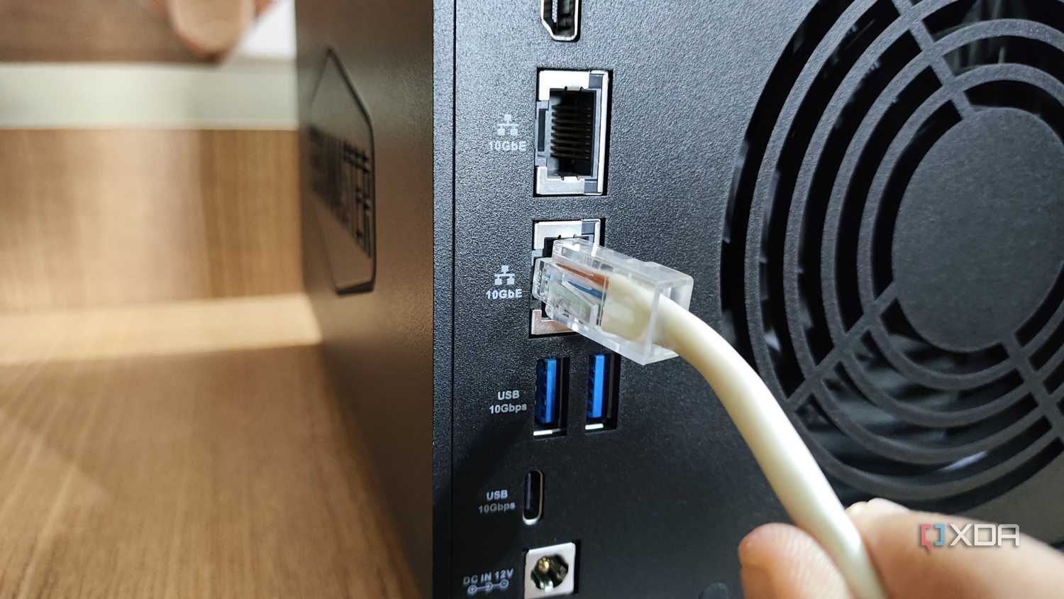 Plugging an Ethernet cable into the 10GbE LAN port on the TerraMaster F4-424 Max NAS