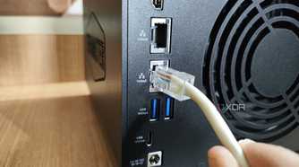 Plugging an Ethernet cable into the 10GbE LAN port on the TerraMaster F4-424 Max NAS