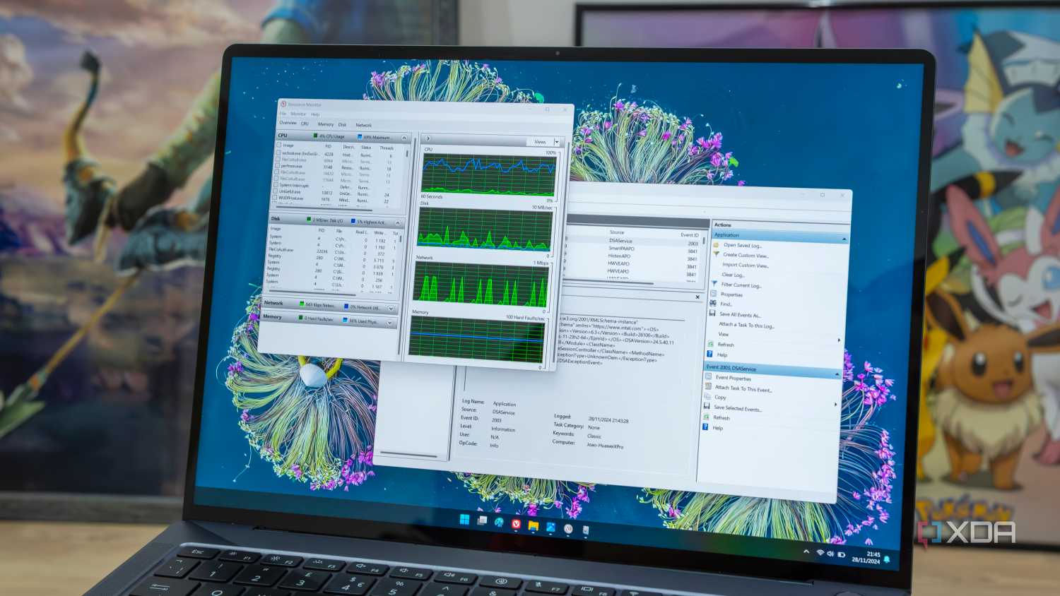 A Windows 11 laptop showing the Resource Monitor and Event Viewer tools