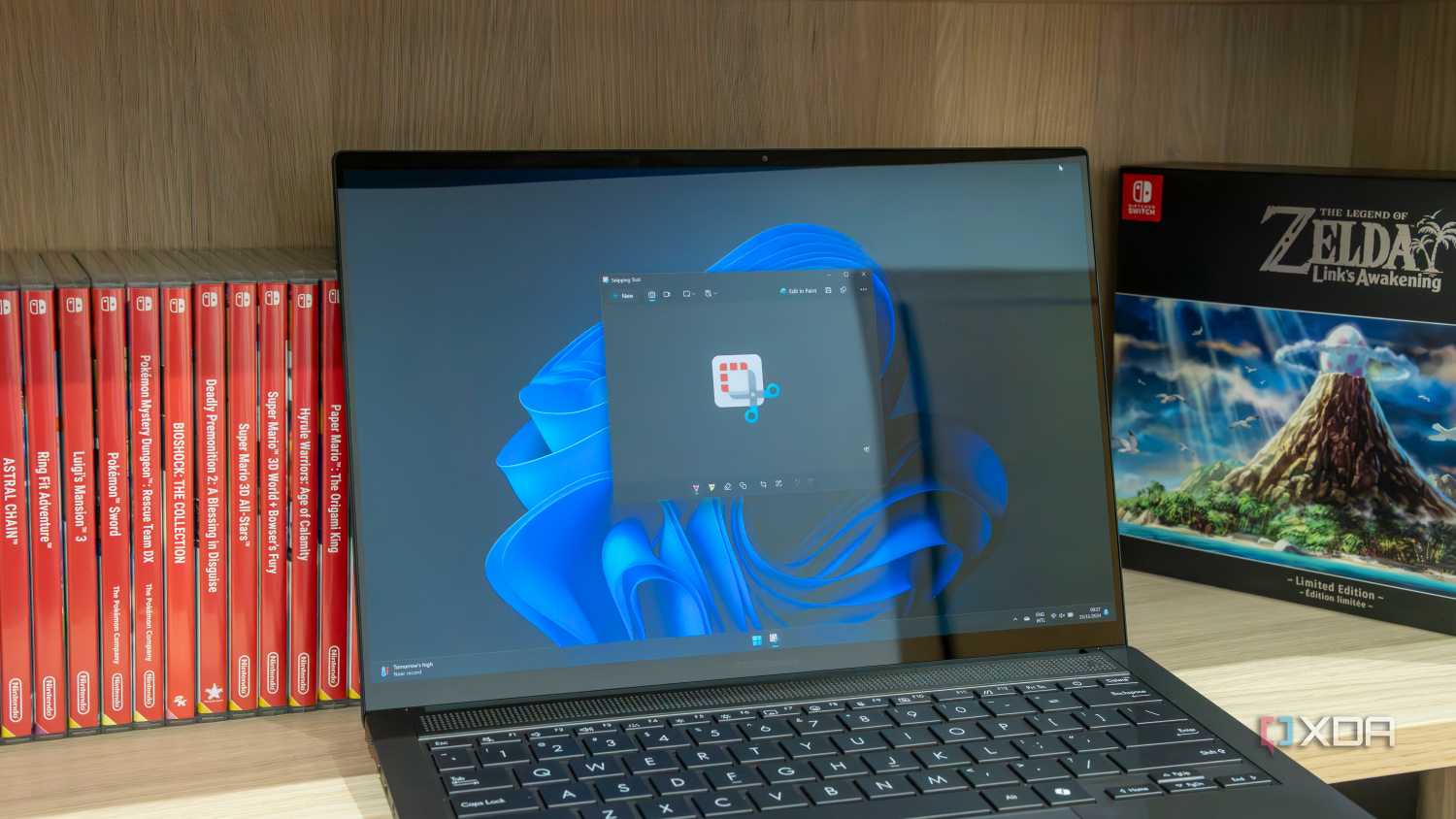 A Windows 11 laptop using the Snipping Tool app with the Snipping Tool logo open