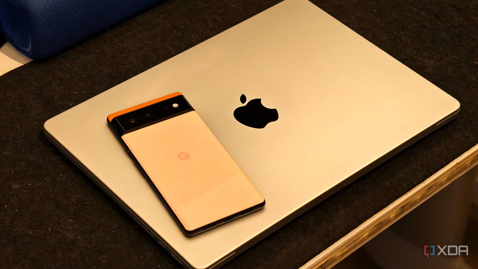 Android phone kept on top of a MacBook