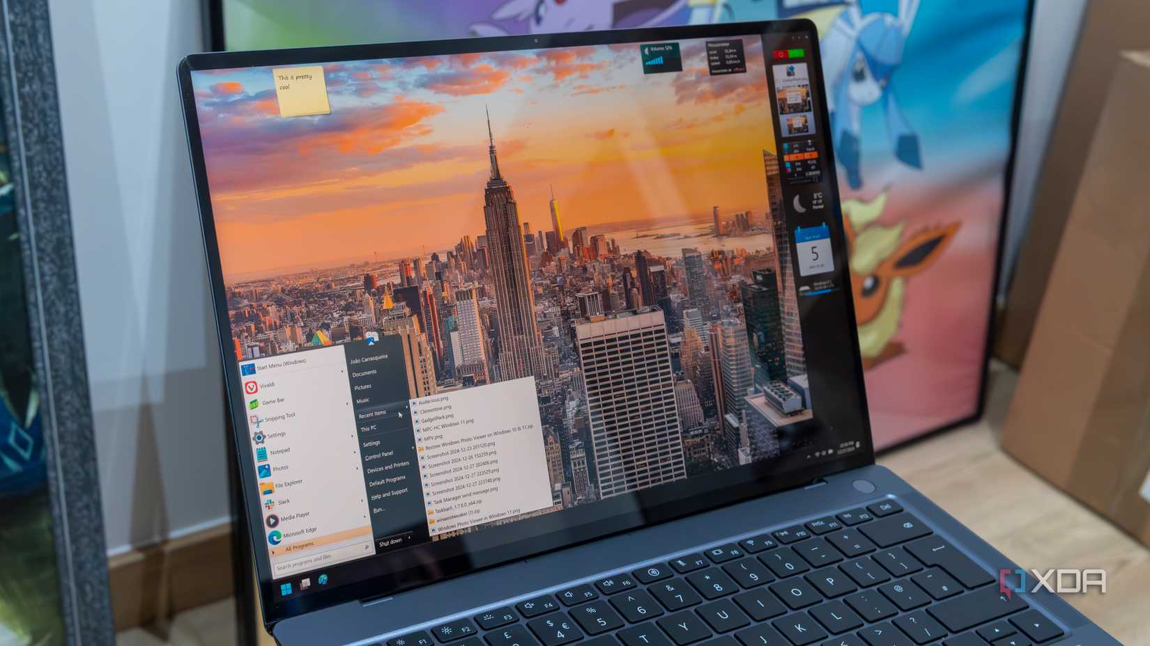 A Windows 11 laptop running OpenShell and GadgetPack to restore the Windows 7 Start menu and gadgets