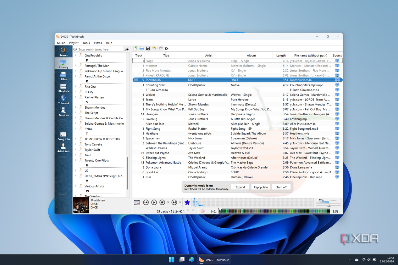 Screenshot of Clementine on Windows 11 with a large playlist loaded and a list of artists on the left side