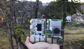 A person holding the Raspberry Pi 5 and Alta SBCs