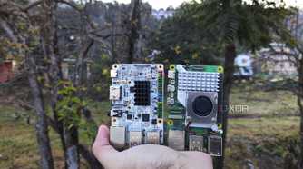 A person holding the Raspberry Pi 5 and Alta SBCs