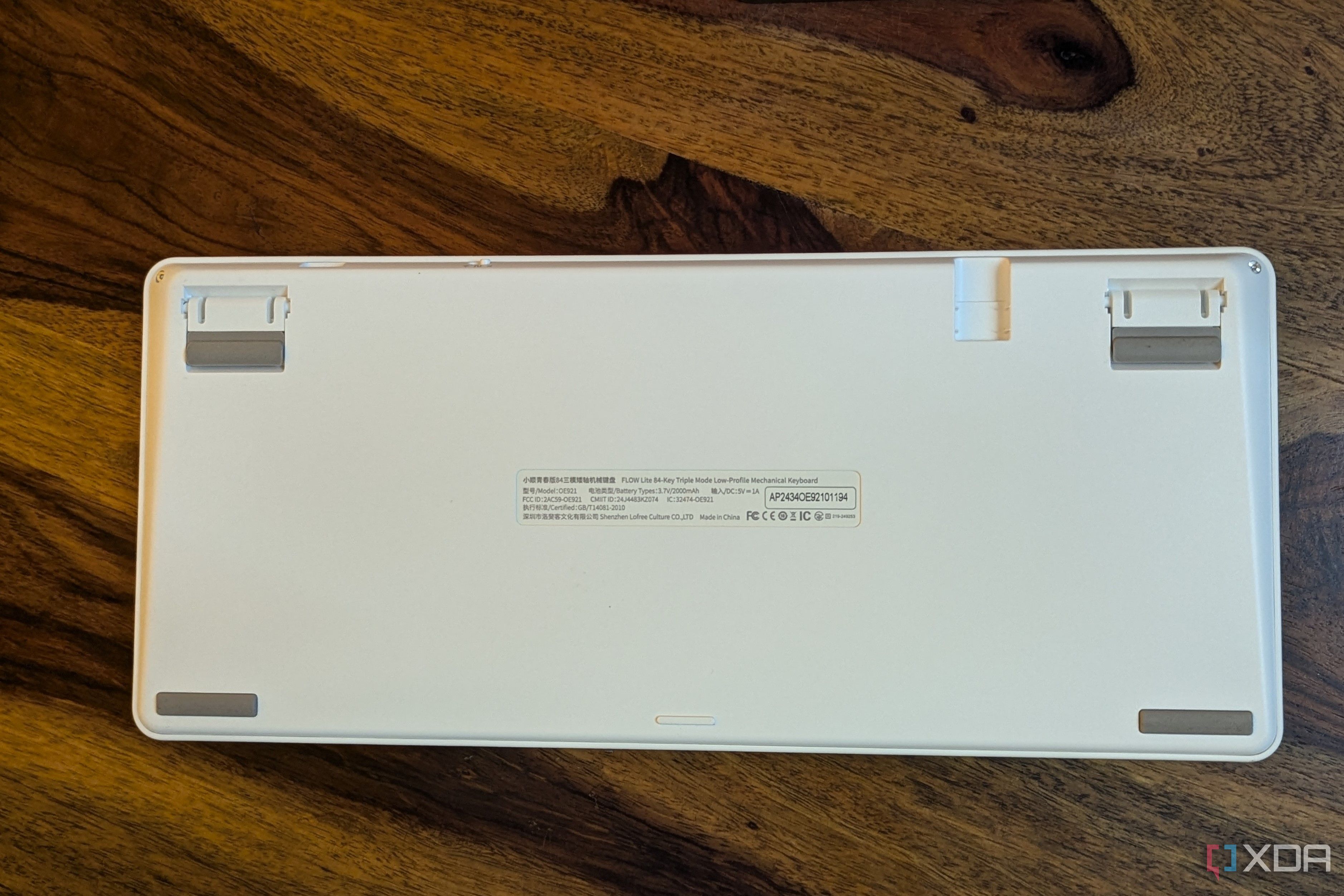 Bottom view of a white low-profile mechanical keyboard