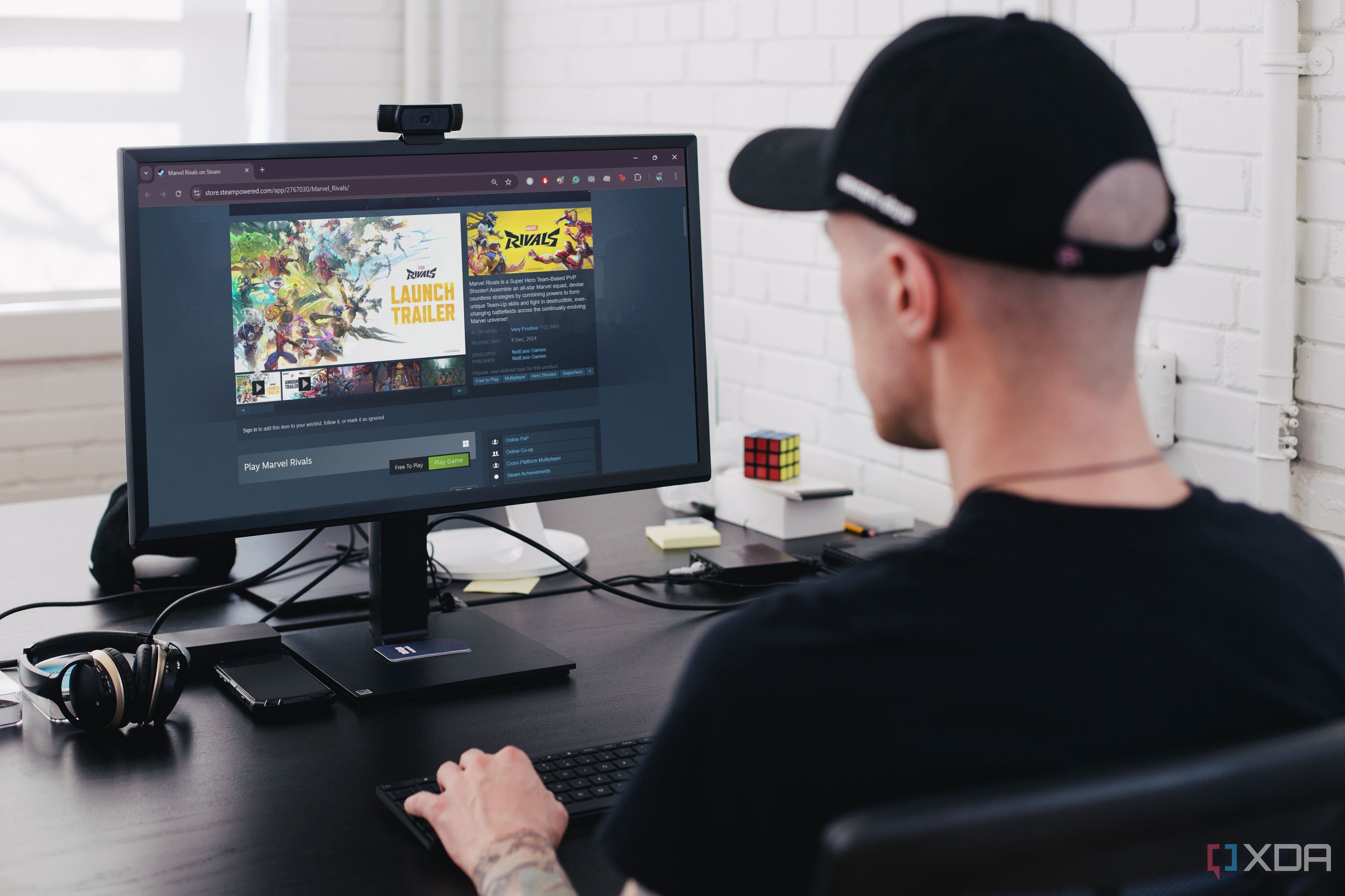 Man downloading Marvel Rivals on PC