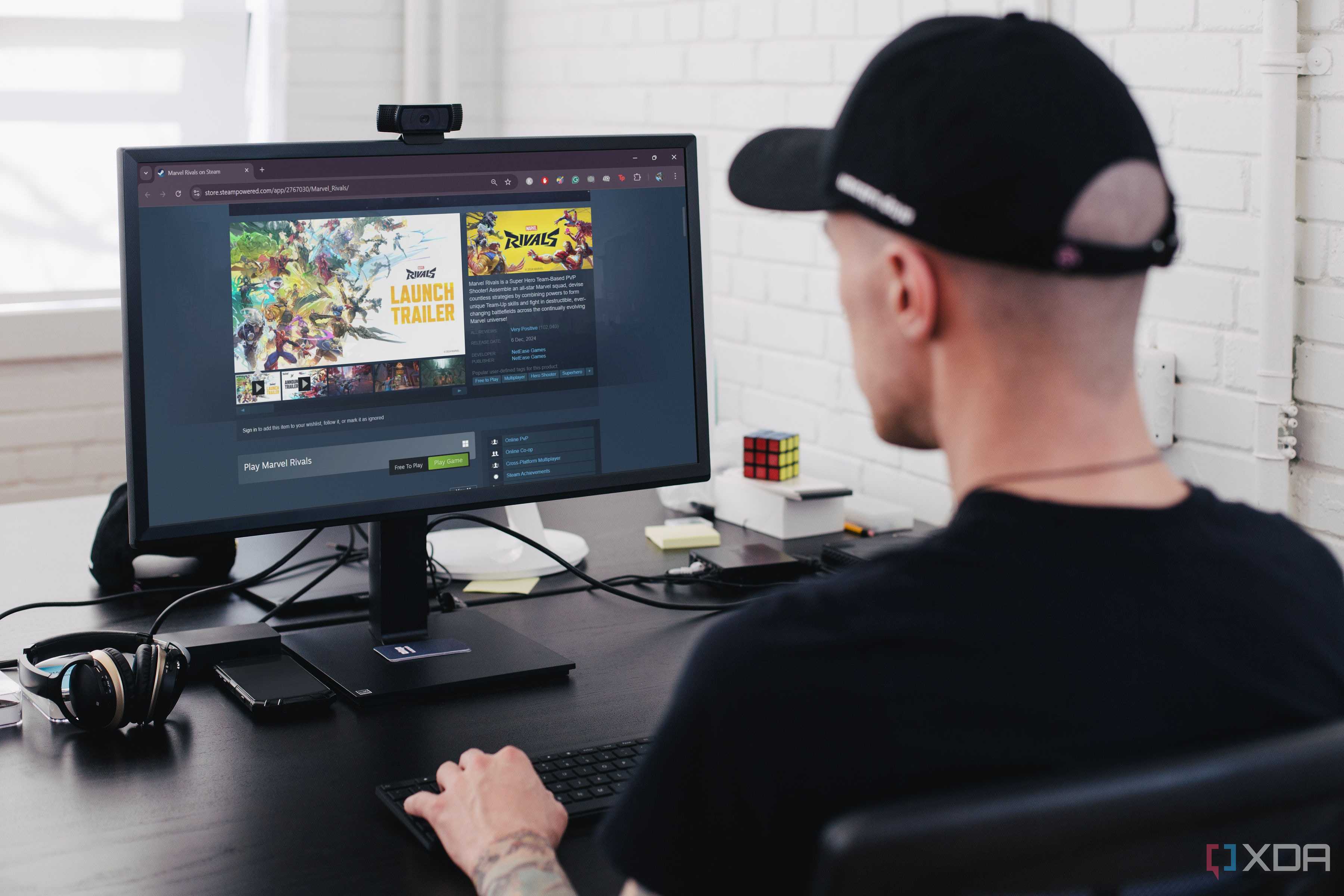 Man downloading Marvel Rivals on PC