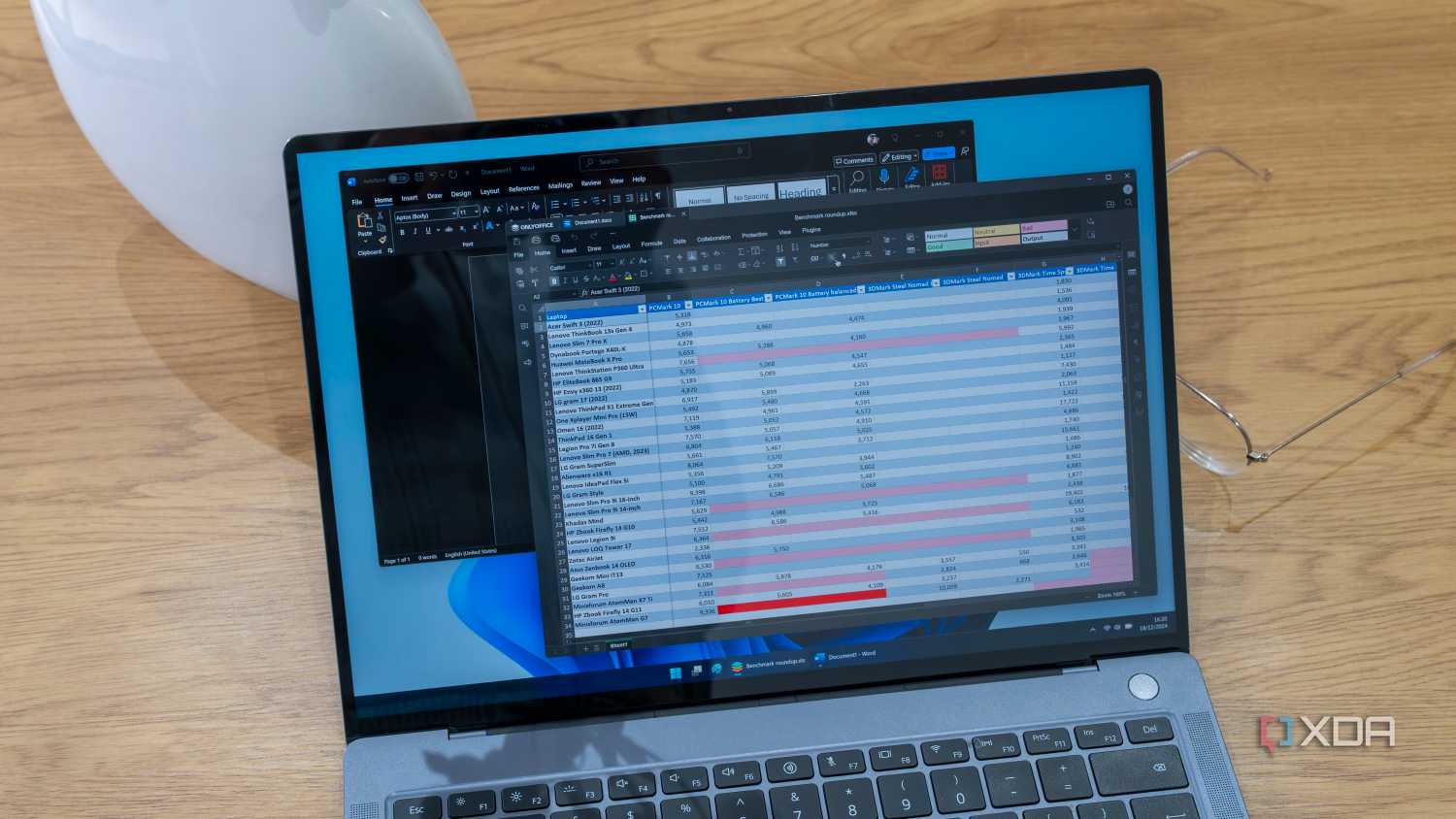 A Windows 11 laptop running OnlyOffice over a Microsoft Word window