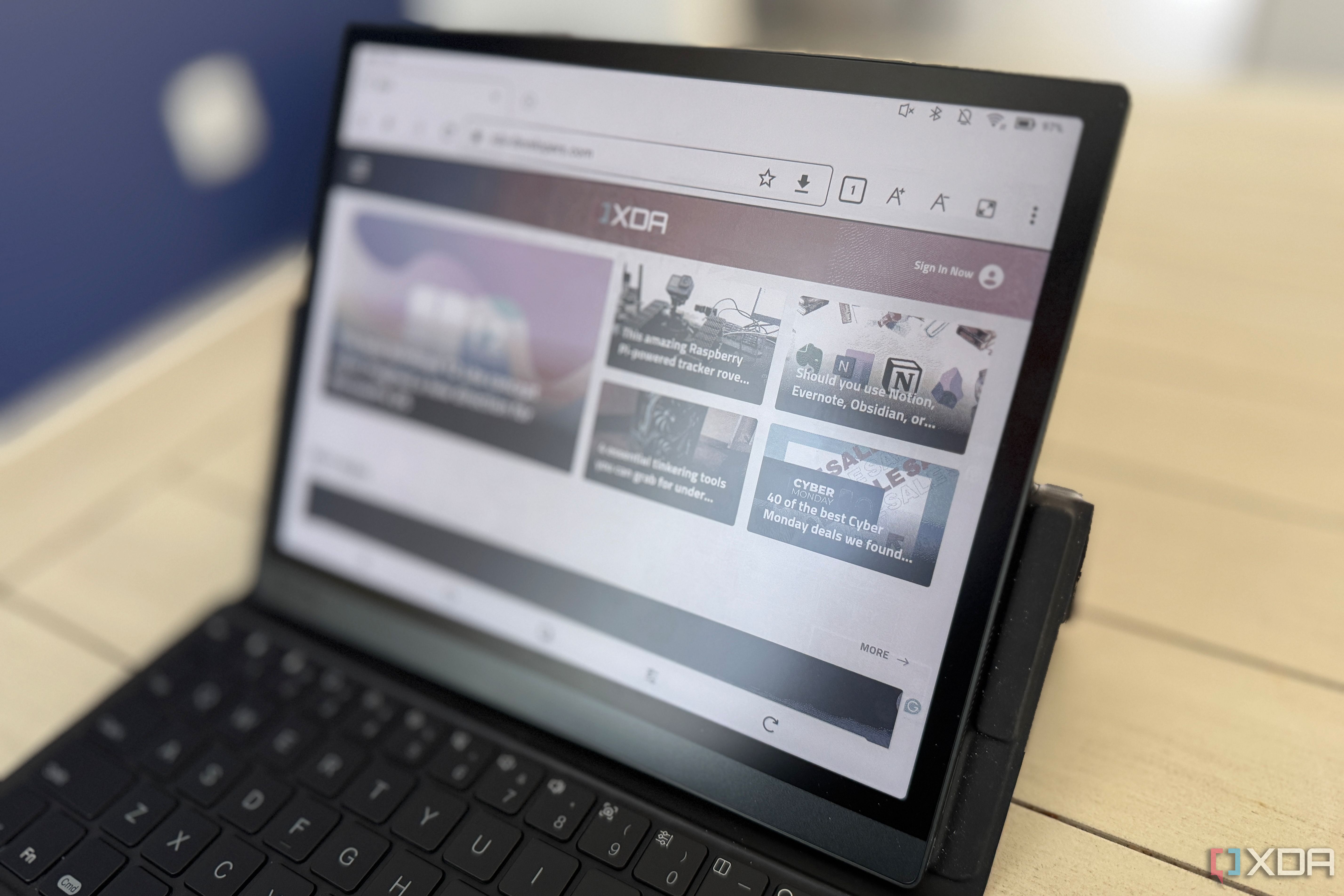 onyx boox tab ultra c pro on a table from a slight right angle showing the xda website