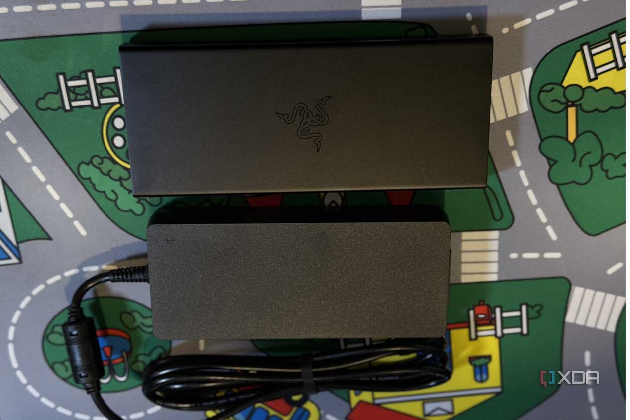 razer usb 4 dock seen from the top next to its power brick