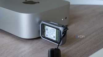 The Satechi Mini NVMe SSD Enclosure plugged into a port on the 2024 Mac Mini, showing the SSD inside