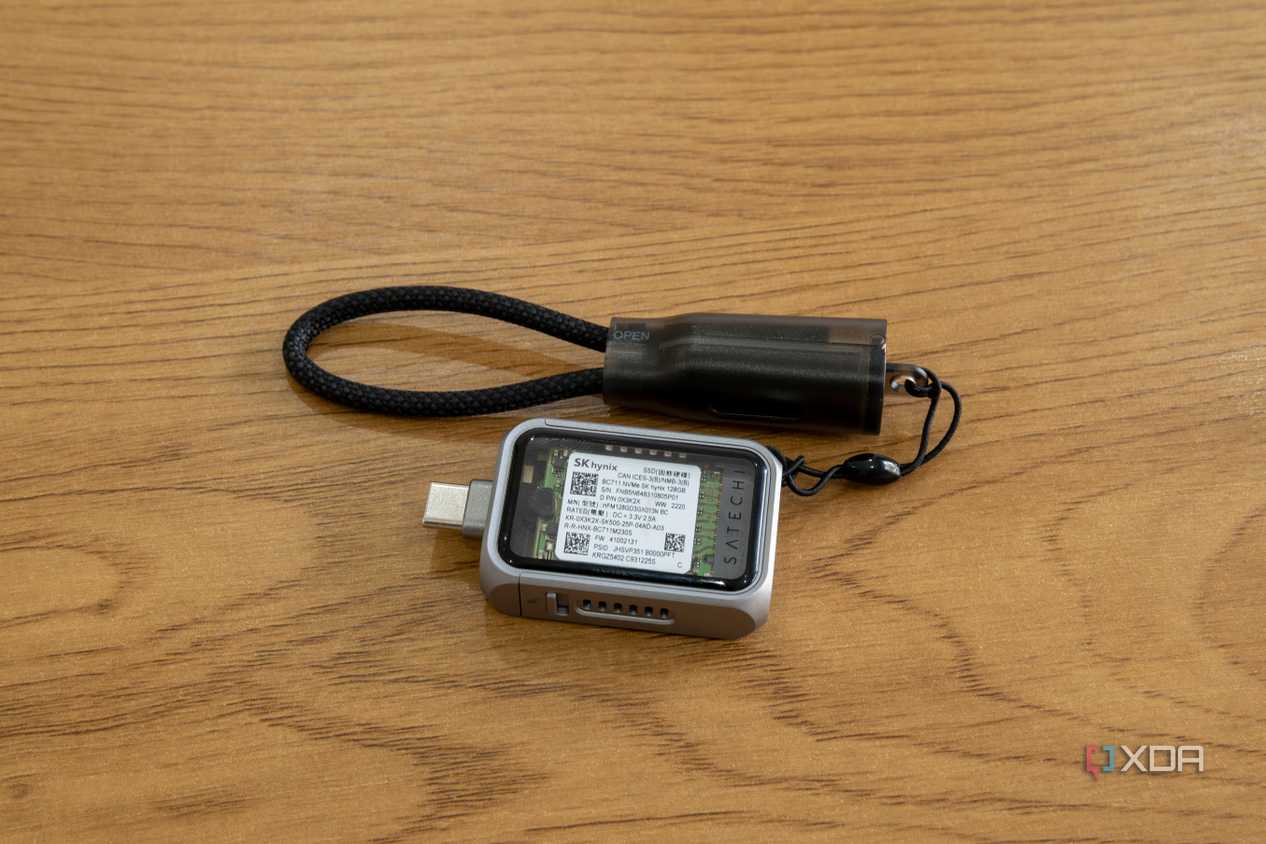 The Satechi Mini NVMe SSD Enclosure with the included USB-C cable lanyard