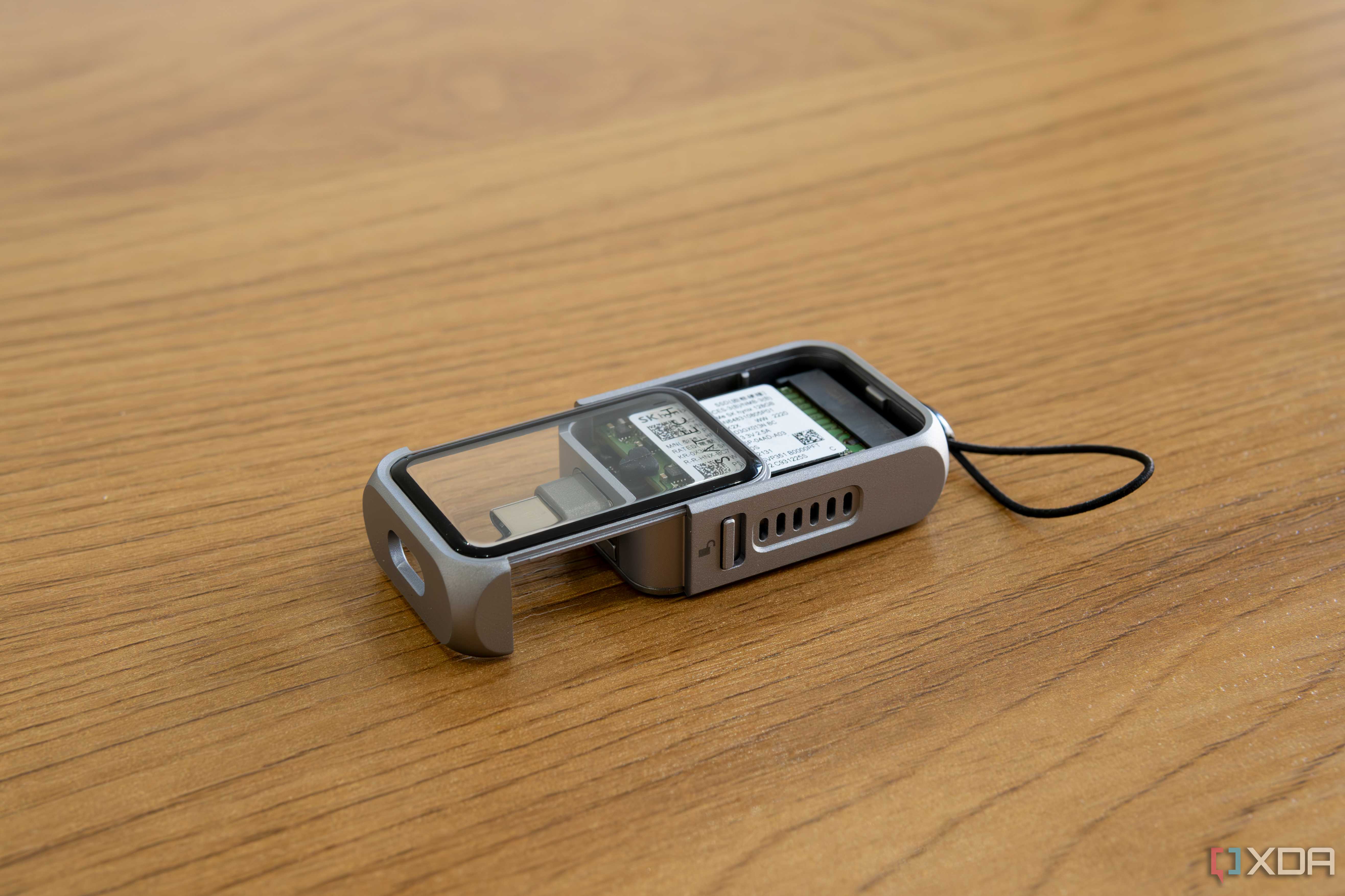 Angled view of the Satechi Mini NVMe SSD Enclosure with the SSD cover partly slid out