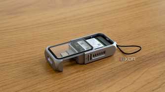 Angled view of the Satechi Mini NVMe SSD Enclosure with the SSD cover partly slid out