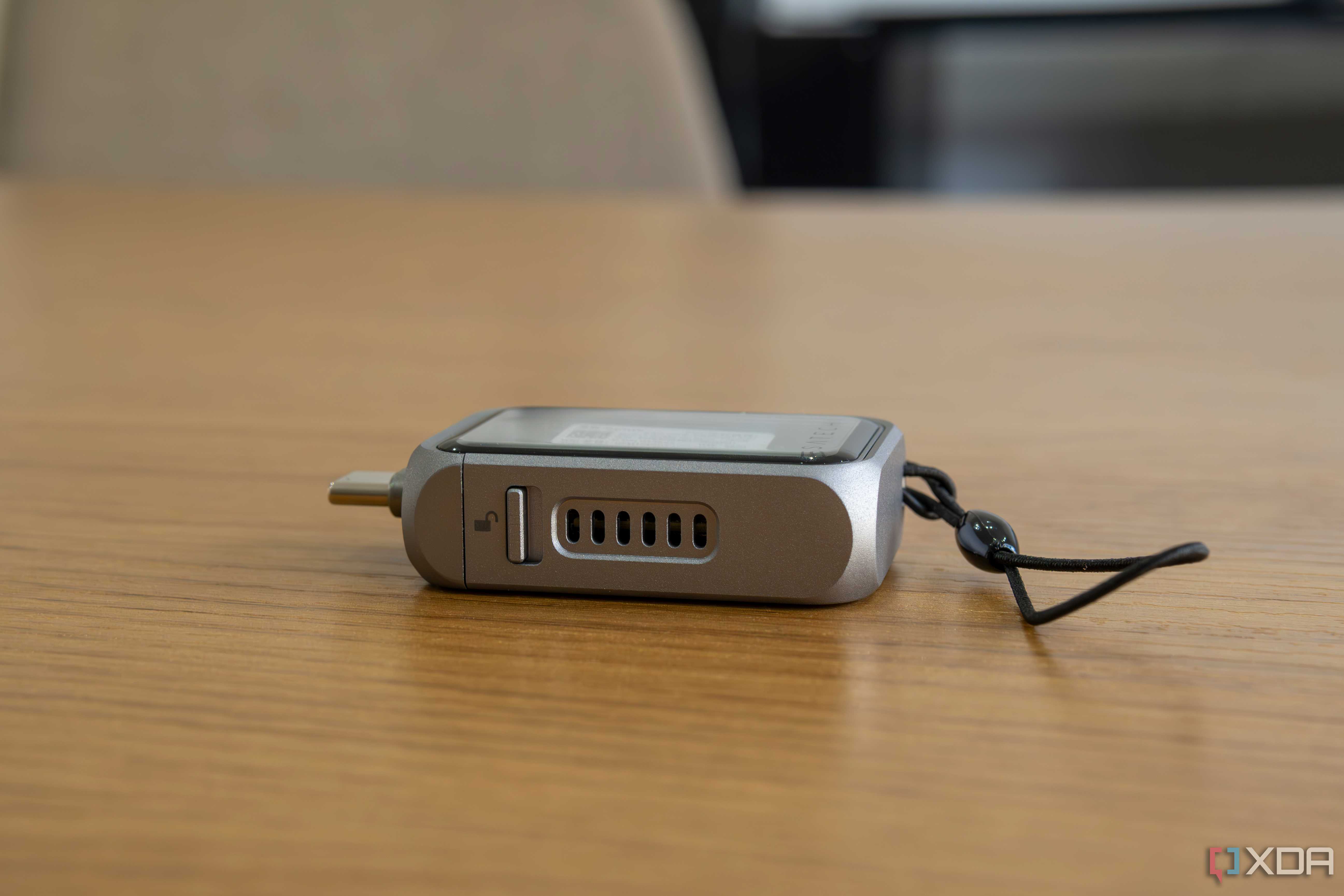Side view of the Satechi Mini NVMe SSD Enclosure showing fan vents and the lock switch