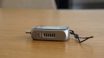 Side view of the Satechi Mini NVMe SSD Enclosure showing fan vents and the lock switch