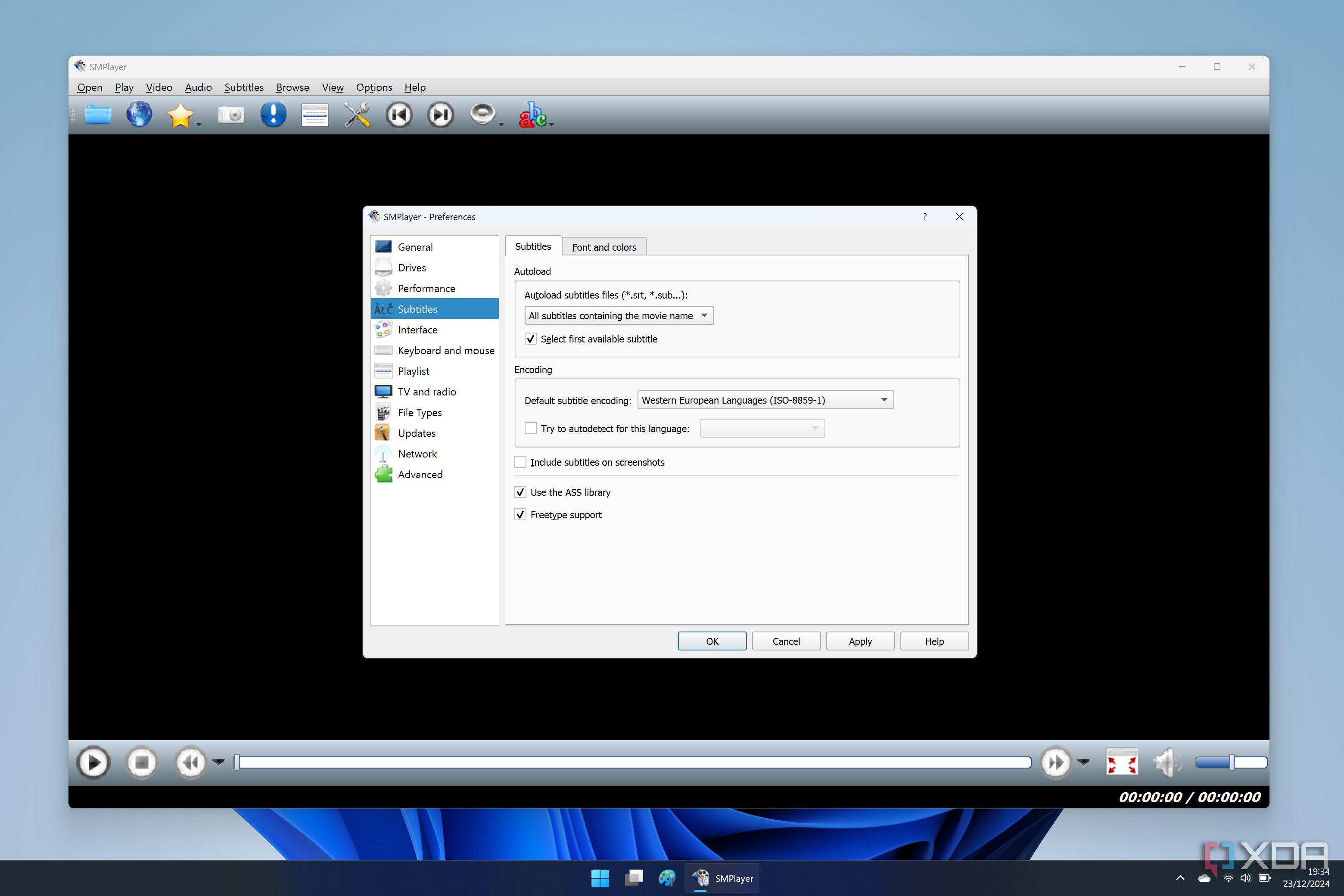 Screenshot of SMPlayer in Windows 11 showing the settings window with options for subtitles