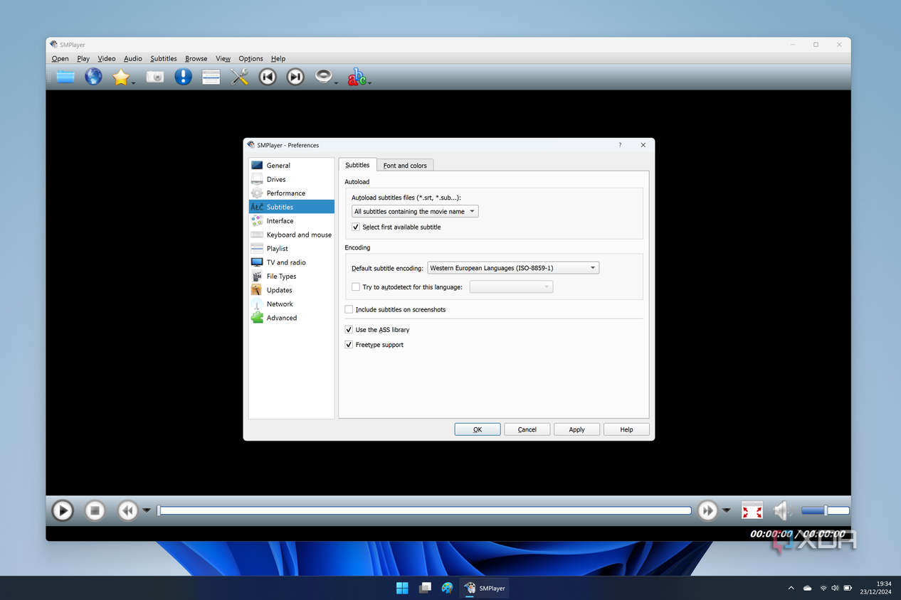 Screenshot of SMPlayer in Windows 11 showing the settings window with options for subtitles
