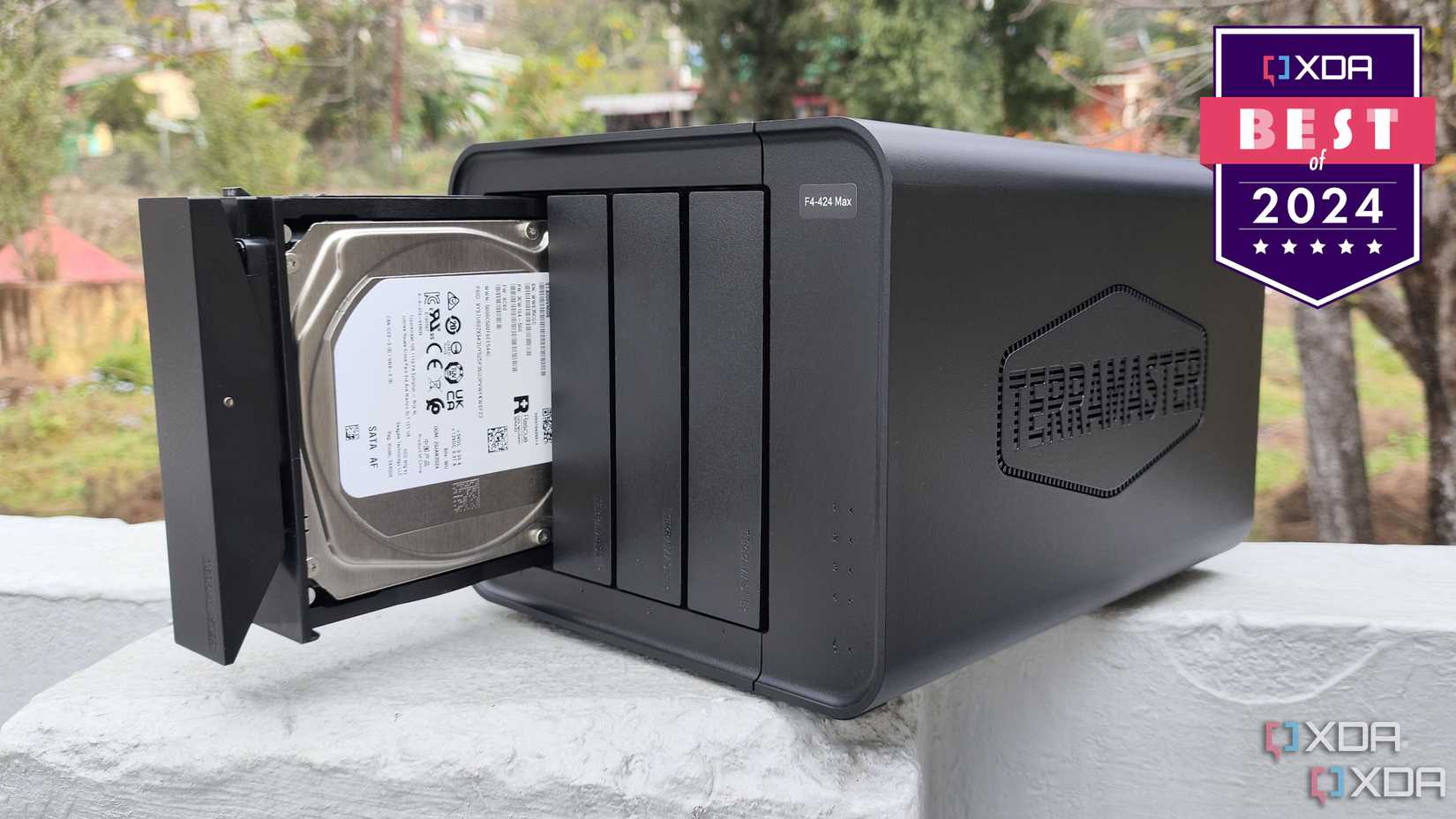 TerraMaster F4-424 on a stone wall with a badge reading XDA Best of 2024
